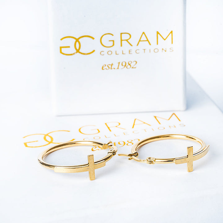 Fabia Earrings placed on its uniquely designed box, standing together in the center of the image against a white background. 