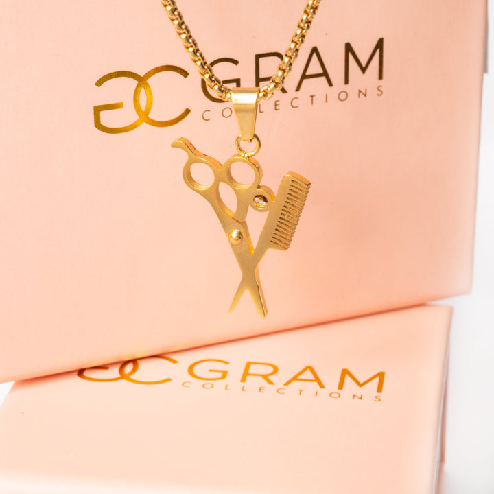 A close up view of The Hairdresser Necklace standing in the center of the image surrounded by its uniquely made 