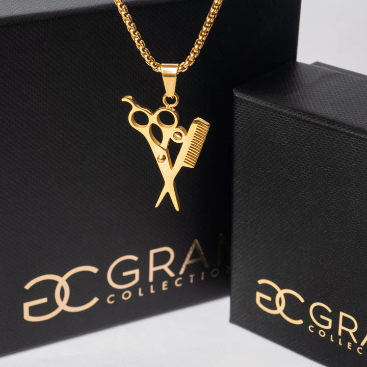 The Hairdresser Necklace standing on the left side on the image surrounded by its gram collections black boxes. 