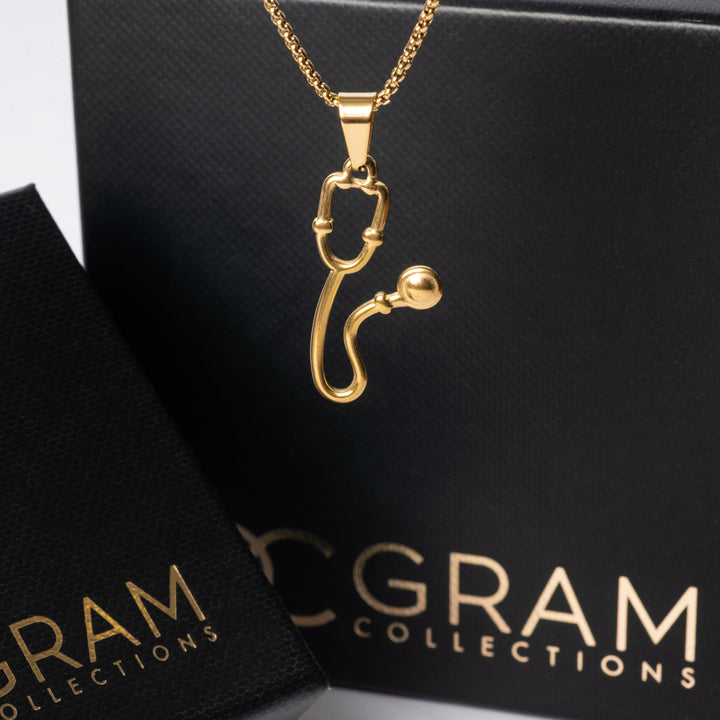 The Health Necklace standing in the center of the image in front of its uniquely designed box. 