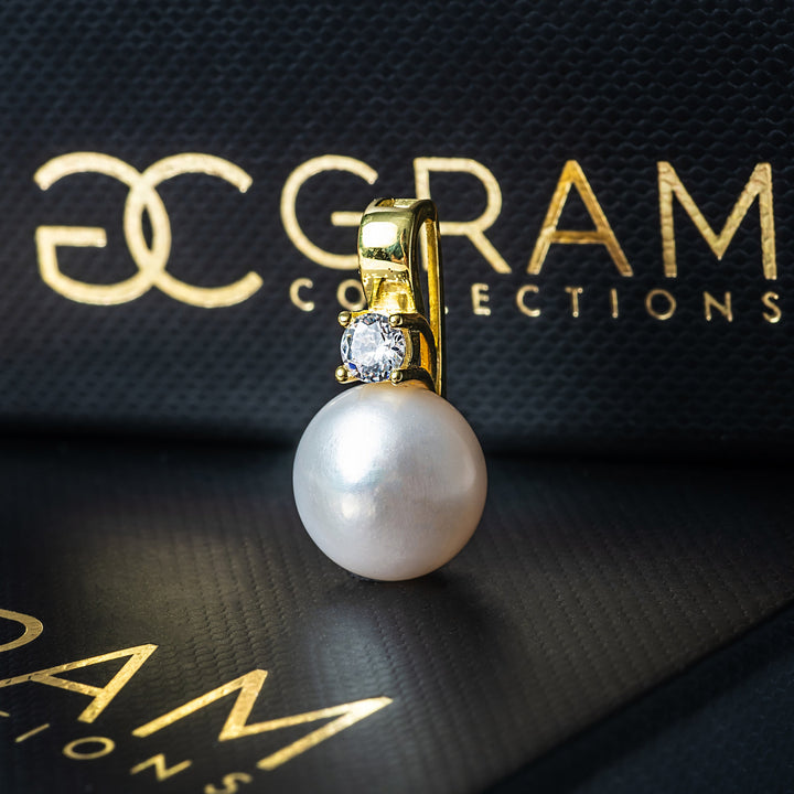 Leonie Necklace standing on its box. 