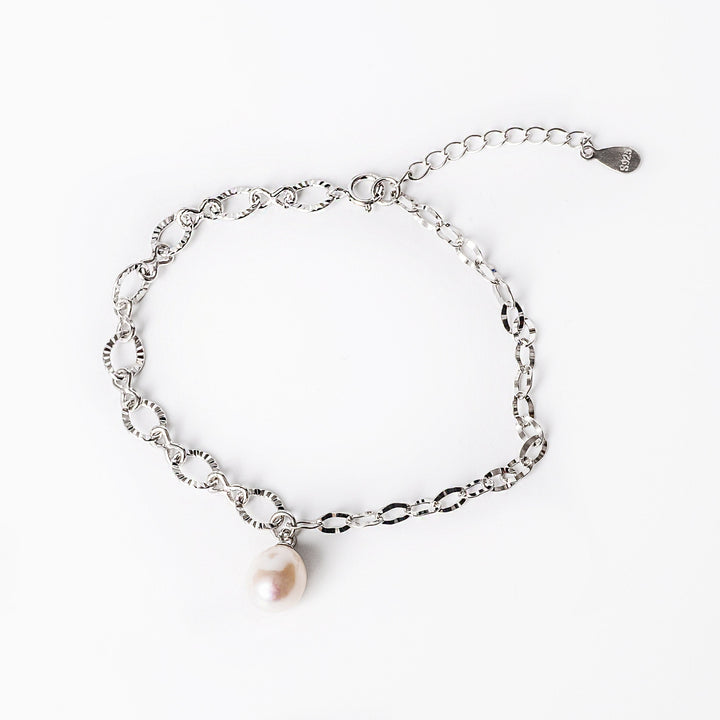 A close up view of Lettie Bracelet standing in the center of the image against a white background. 