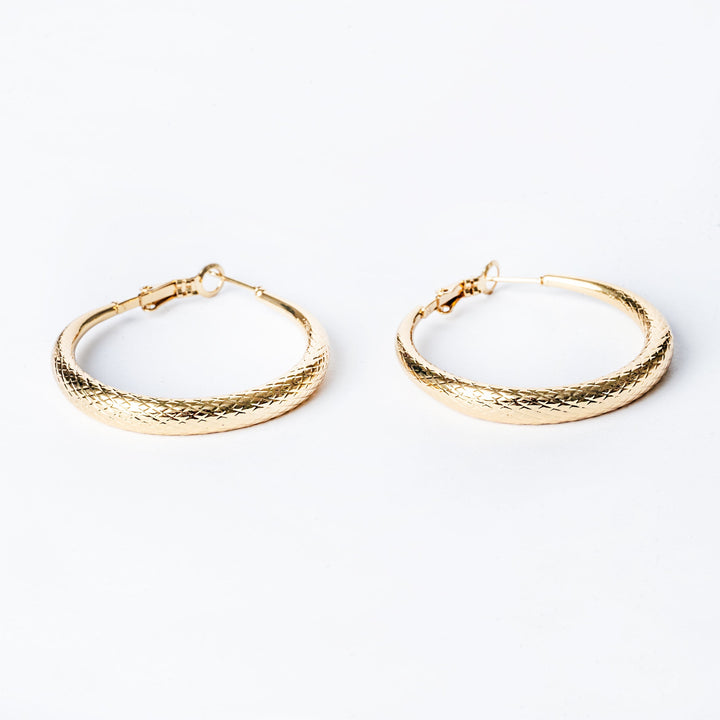 Gram's collections female Romina Earrings jewelry, standing in the center of the image against a white background. 