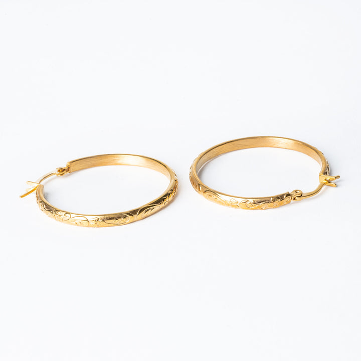 detached pair of Sue Earrings standing together against a white background. 