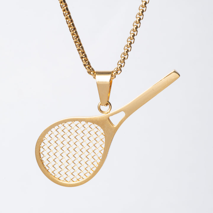 A gold-colored tennis racket-shaped pendant necklace on a chain.