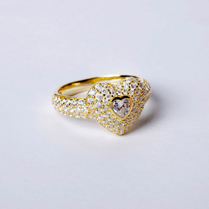 A close up view of Ti Amo Ring standing in the center of the image against a white background. 
