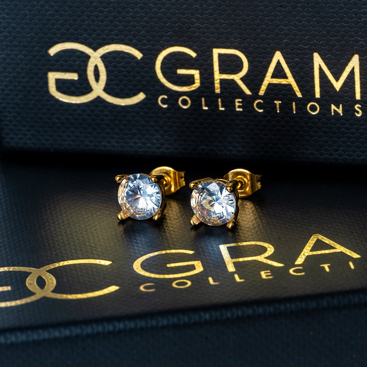 Tommy Earrings standing in the center of the image placed in its box. 