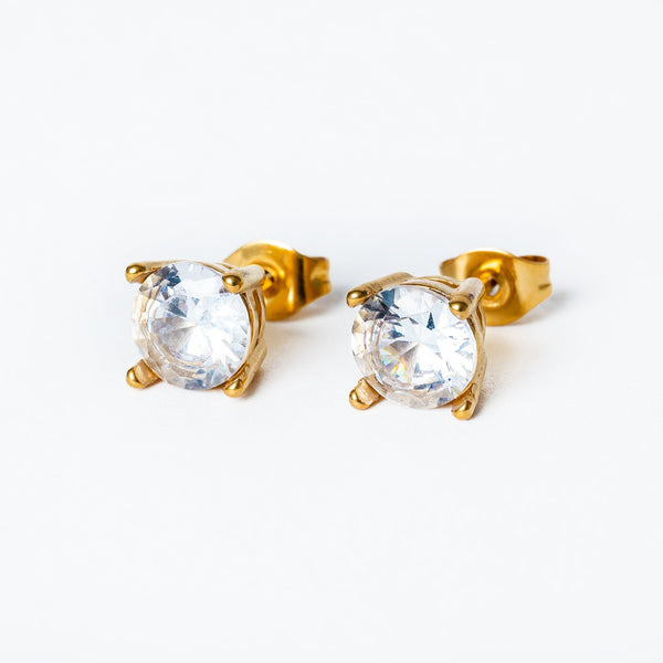 A pair of gold-plated stainless steel earrings with clear cubic zirconia gems.