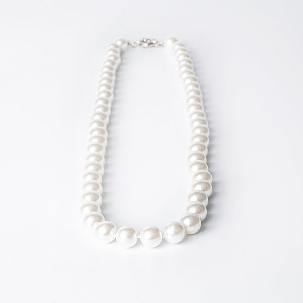 A silver-colored pearl  Twilight necklace with a clasp closure, displayed against a white background.
