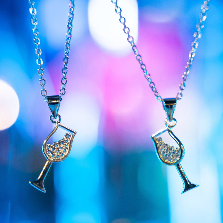 Two bartender necklace standing in the center of the image, against a bluer background. 