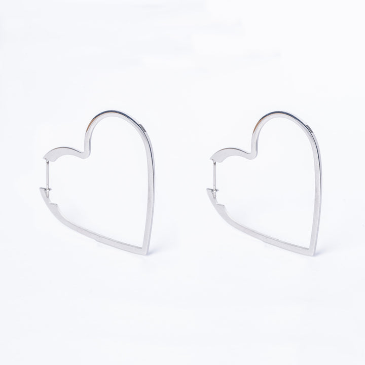 A close up view of Valentina Silver Earrings standing next to each other against a white background. 