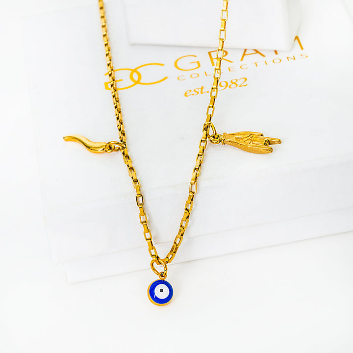 Xorti necklace with an eye charm on a white background with 'DC' branding.