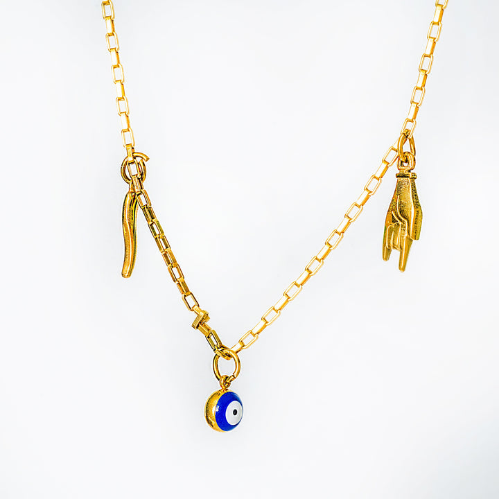 Xorti necklace with charms on a white background