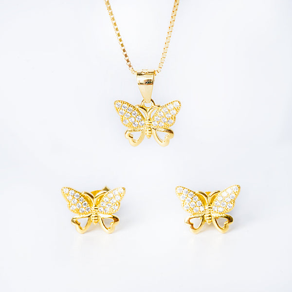A set of yellow gold-colored jewelry including a pendant, chain, and earrings with butterfly designs, adorned with cubic zirconia.