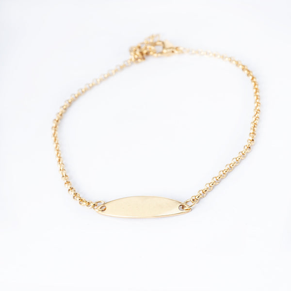 A yellow gold-plated stainless steel Alexia bracelet with a solid pattern, displayed against a white background.