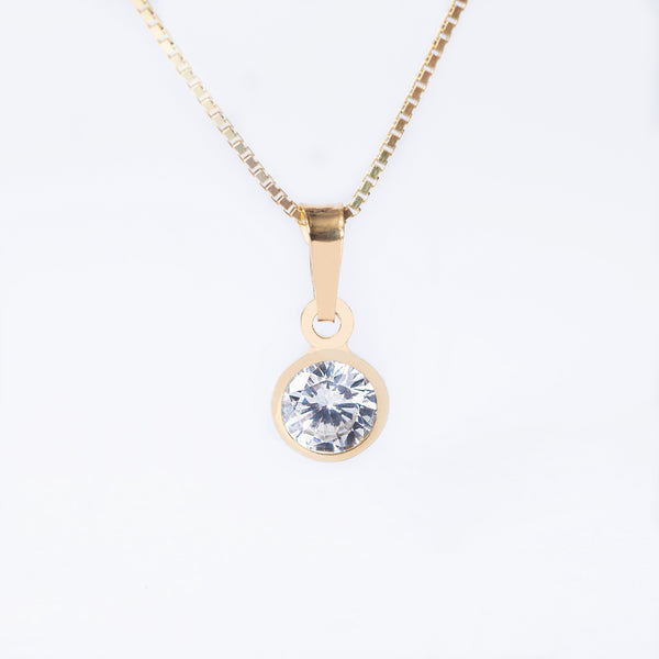 A gold-plated sterling silver April Birth Stone pendant with a white diamond gemstone in the center, attached to a yellow gold chain.