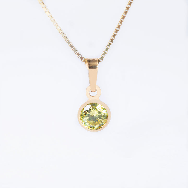 A yellow gold-plated sterlingAugust Birth Stone pendant with a central cubic zirconia gem, surrounded by smaller clear beads, attached to a gold-plated chain.
