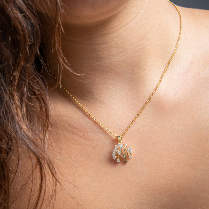 Woman wearing  Gram collections's Tree Of Life Necklace around her neck