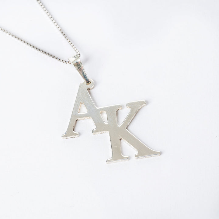 Close up view of Double Initial Silver Necklace.