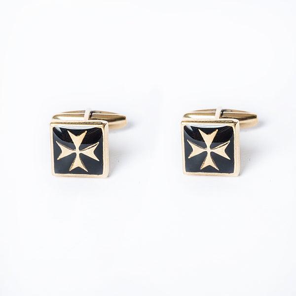 A pair of gold-plated silver cufflinks with black enamel crosses on a white background.