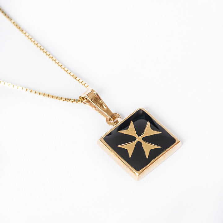 A bird view of Gianni Gold pendant standing in the center of the image against a white background. 