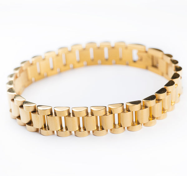 A gold-plated stainless steel bracelet with a yellow gold finish, displayed on a white background.