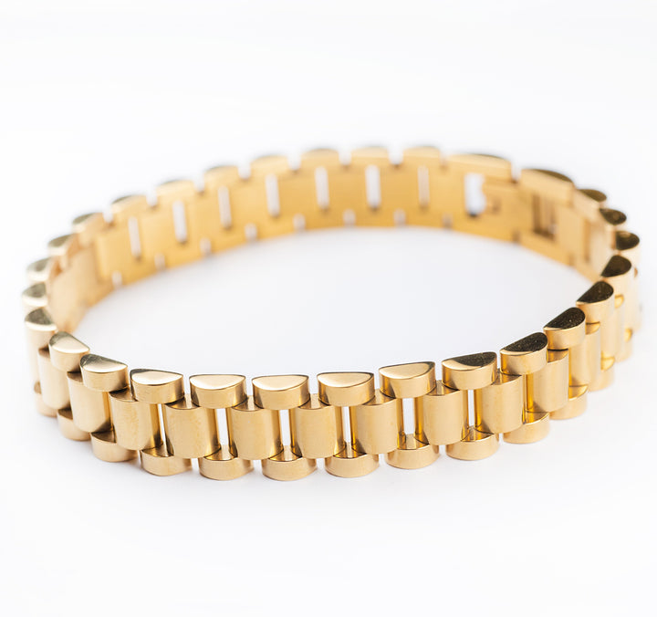 A gold-plated stainless steel bracelet with a yellow gold finish, displayed on a white background.