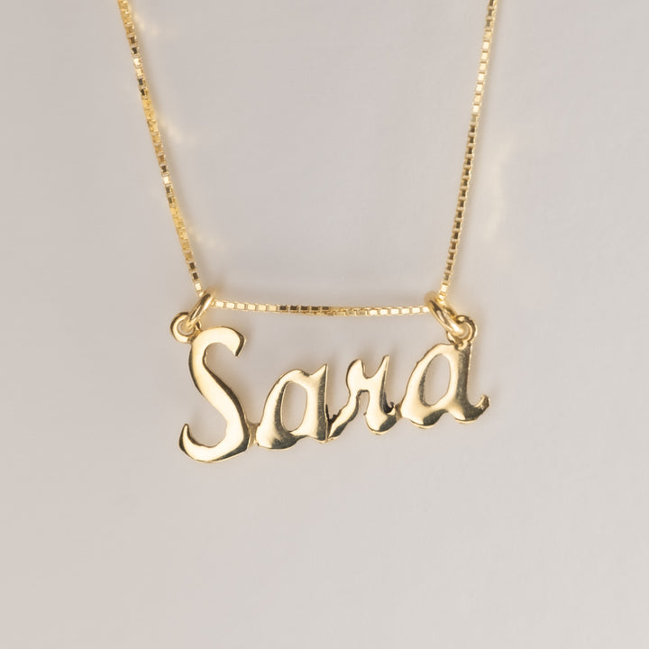A close up view of gram collection Sara nekclace. 
