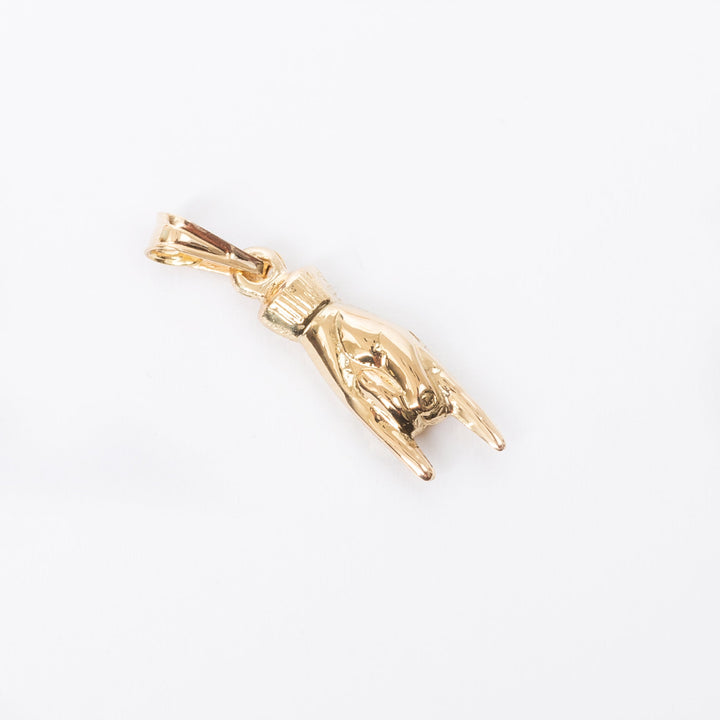 A gram collections horn pendant standing in the center of the image against a white background. 
