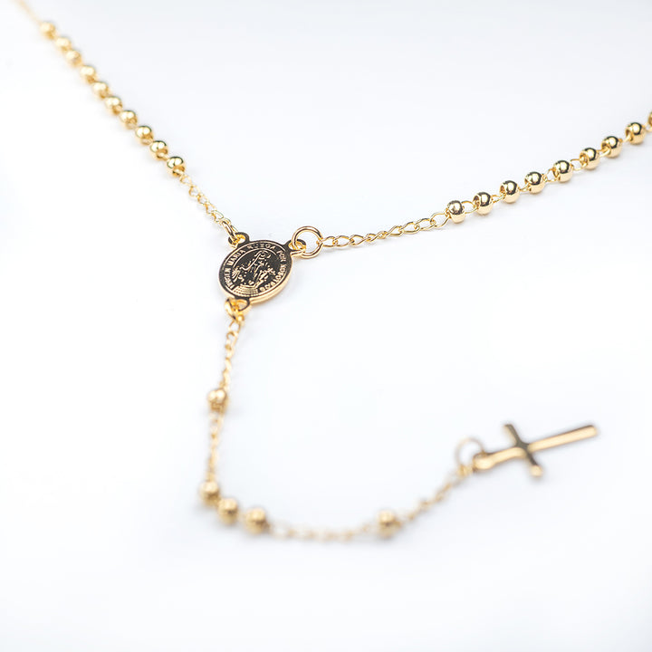 Rosary Beads close up view of its pendants. 