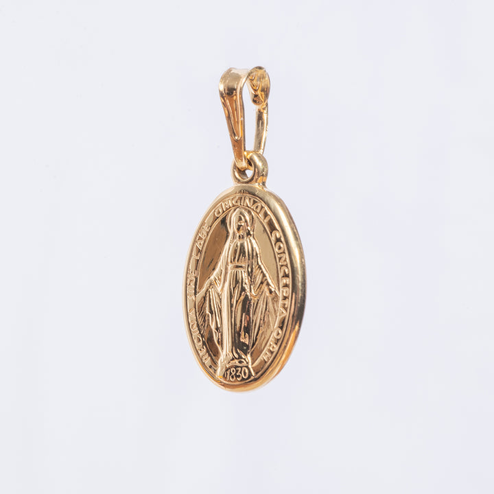 A close up view of holy mary medal double sided pendant