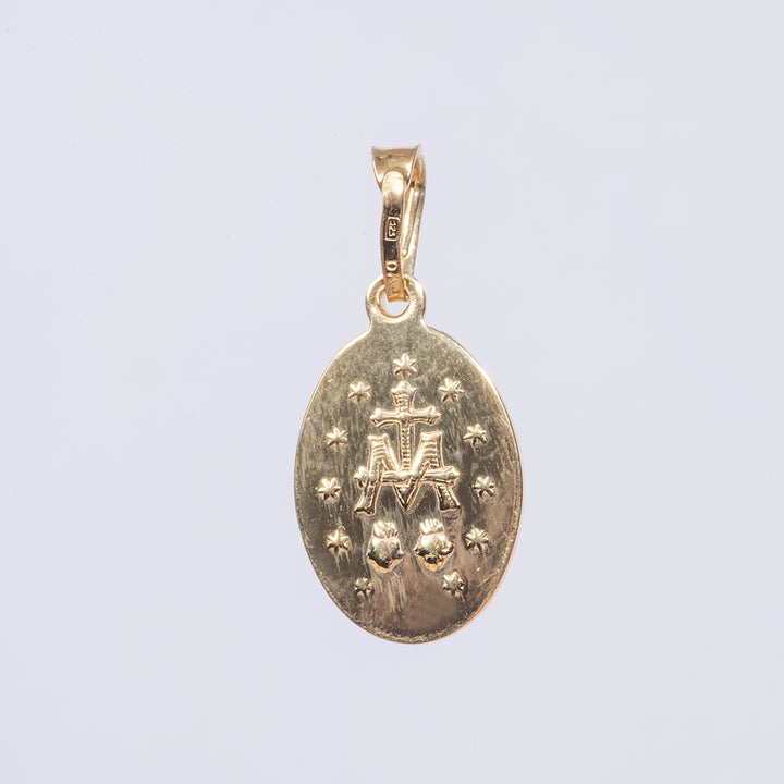 A detail of a symbols on the holy mary medal double sided pendant 