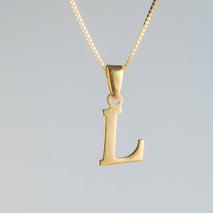 A c lose up view initials gold letter pendant l letter  