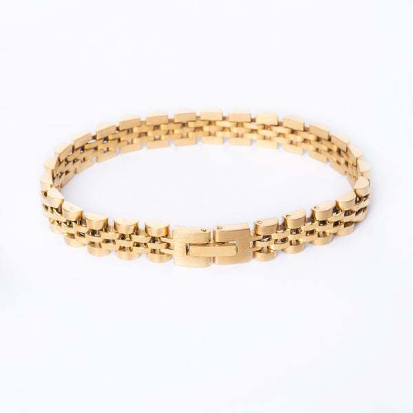 A yellow gold-plated stainless steel bracelet with a clasp, displayed on a white background.