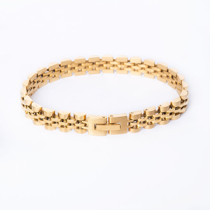 A yellow gold-plated stainless steel bracelet with a clasp, displayed on a white background.