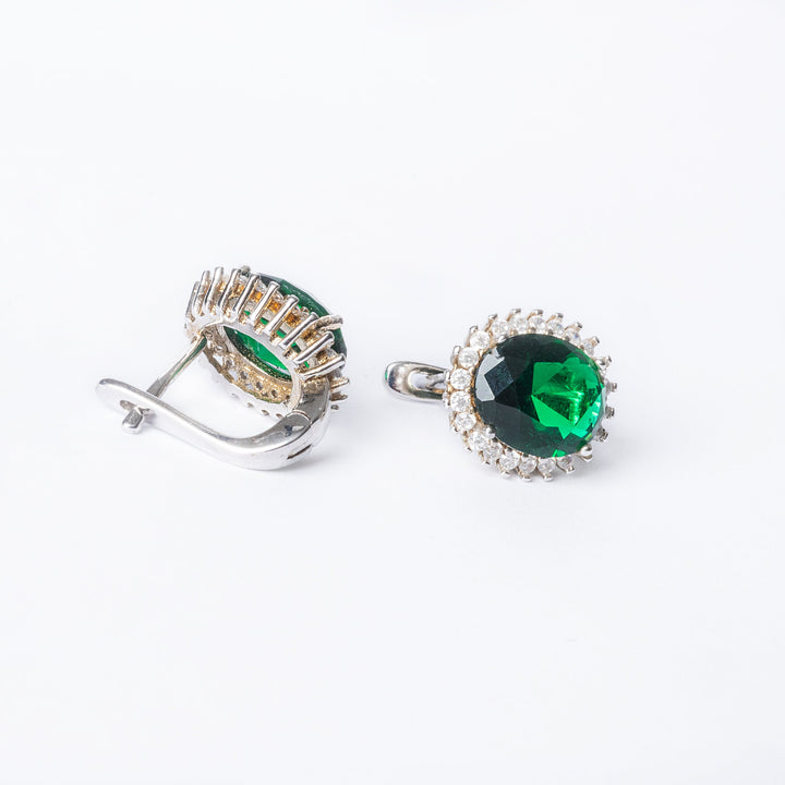 A close up view of back side of Kate Earrings standing in the center of the image against a white background.