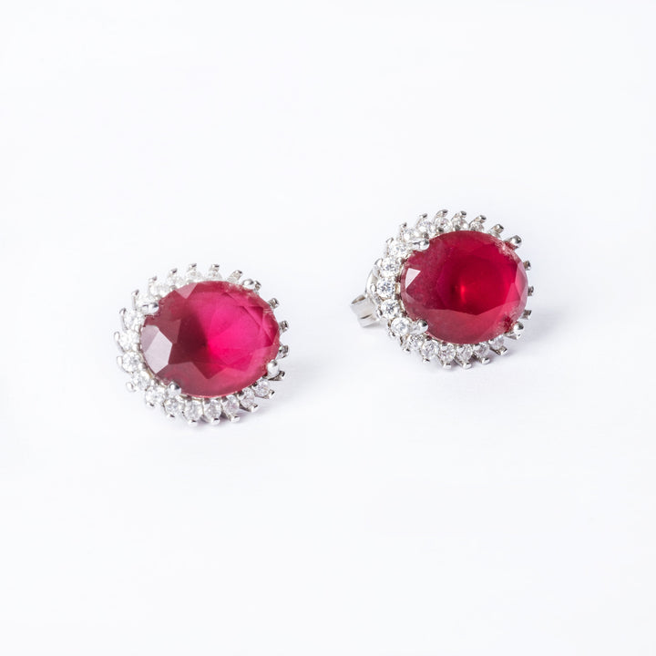 A close up view of Kate Earrings in red colur standing in the center of the image against a white background. 
