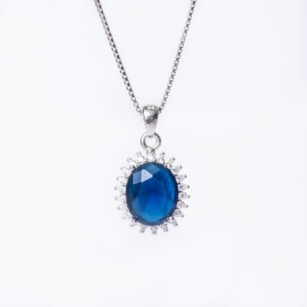 A close up view of Kate Necklace standing in the center of the image against a white background. 
