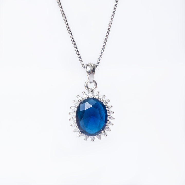 A close up view of Kate Necklace standing in the center of the image against a white background. 