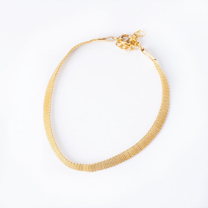 A close up view of Maderia bracelet standing in the center of the image against a white background. 