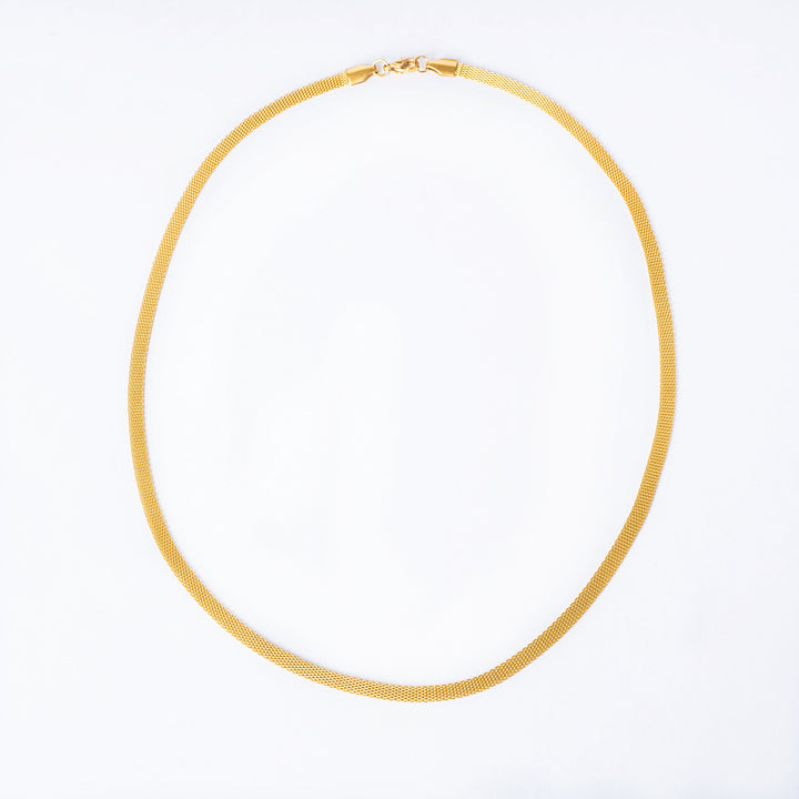 A close up, bird view perspective of madeiran necklace, placed in the center of the image against a white background. 