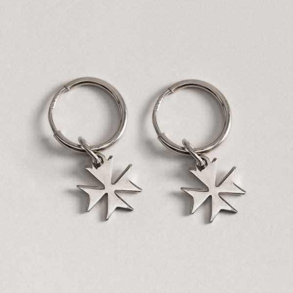 A pair of silver-colored Malta cross hoop earrings designed in the shape of a Maltese cross, displayed against a white background.