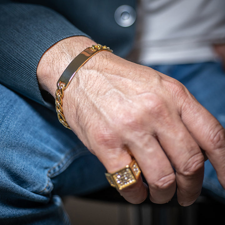 A close up view of a man's hand wearing Male ID Bracelet