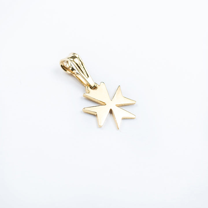 A close up view of Melita Gold Maltese Cross Pendant. 