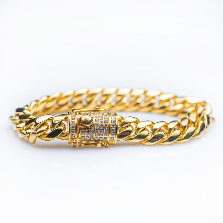 A yellow gold-plated stainless steel bracelet featuring a series of shiny, cubic zirconia embellishments.