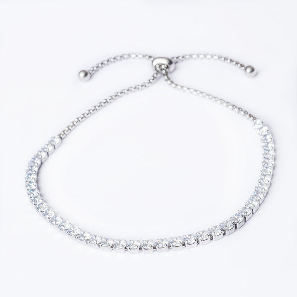 A silver muftie bracelet with AAA Cubic Zirconia stones, featuring a sliding closure.