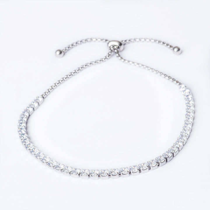A silver muftie bracelet with AAA Cubic Zirconia stones, featuring a sliding closure.