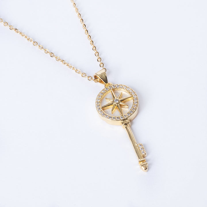 A close up view of Il-Muftieh Necklace standing in the center of the image against a white background, seeing from a birdview. 