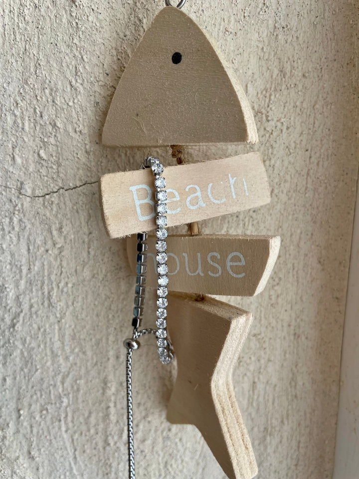 Il-Muftieh Necklace attached to wooden made fish. 