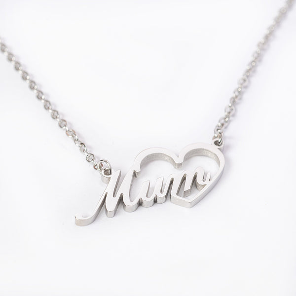 A silver Mum necklace with a heart-shaped pendant that has the word 'MUM' engraved on it.